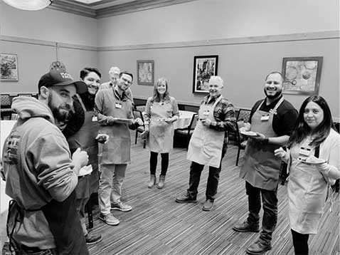 Company staff posing for a photo in the showroom